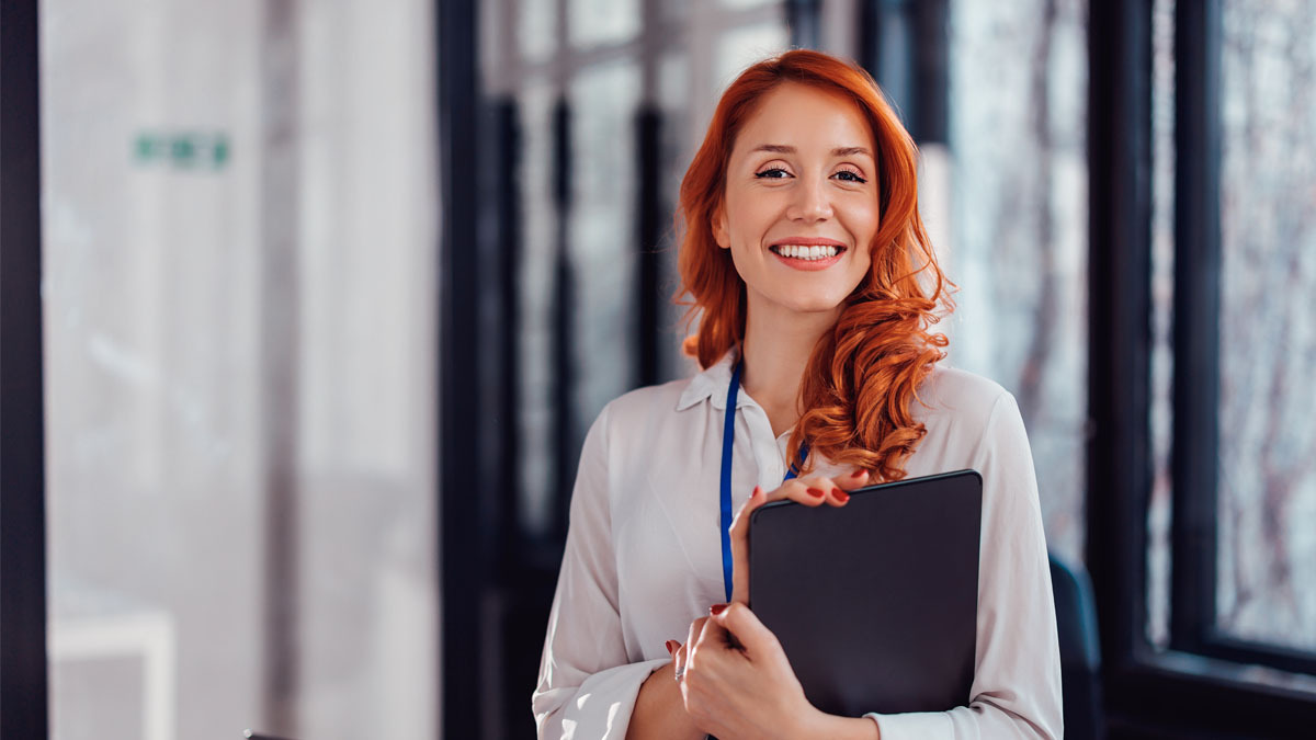 General counsel lady standing with folder to showcase step-by-step implementation roadmap